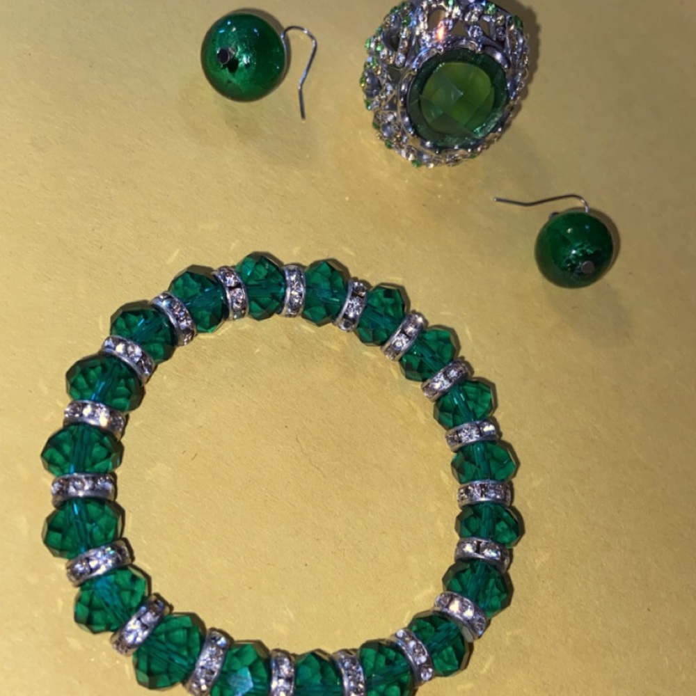 Emerald ring, earrings, and bracelet
